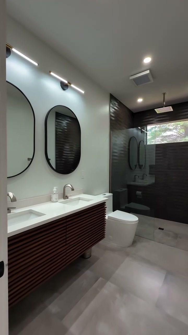 3D textured tile shower wall — the builder's signature tilework